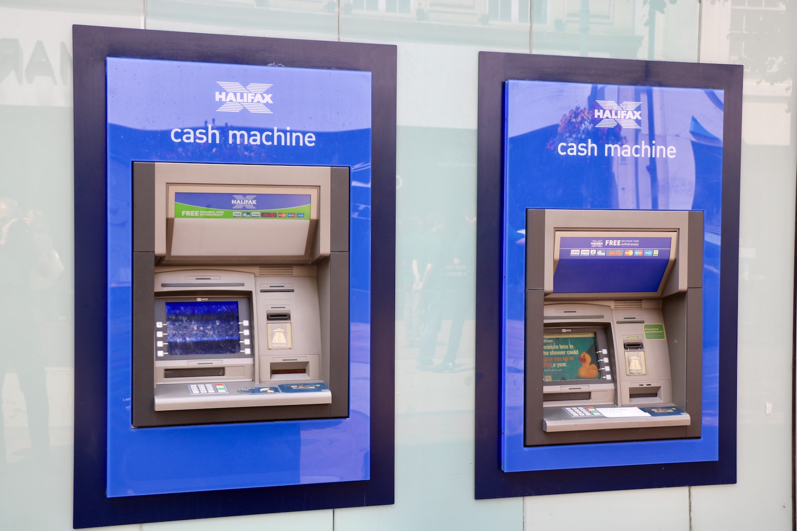 two blue and black Halifax Cash Machines